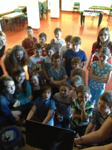 The children watching a video from a certain dance group. 
